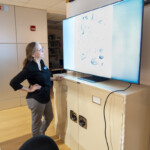 Shelly looks at slide.